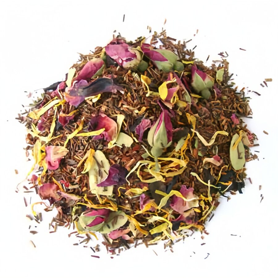 Luxurious Amorous Brew Ceylon black tea tin with rose petals and a teacup on a lace tablecloth in a romantic candlelit setting.